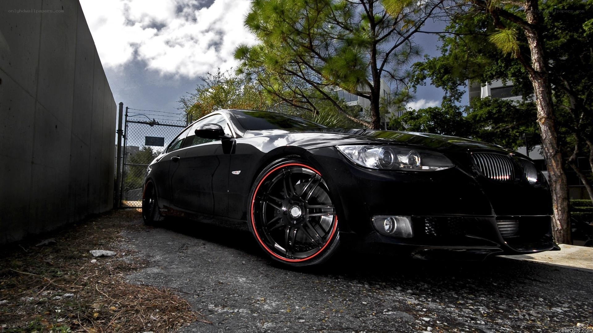 black bmw with red rims