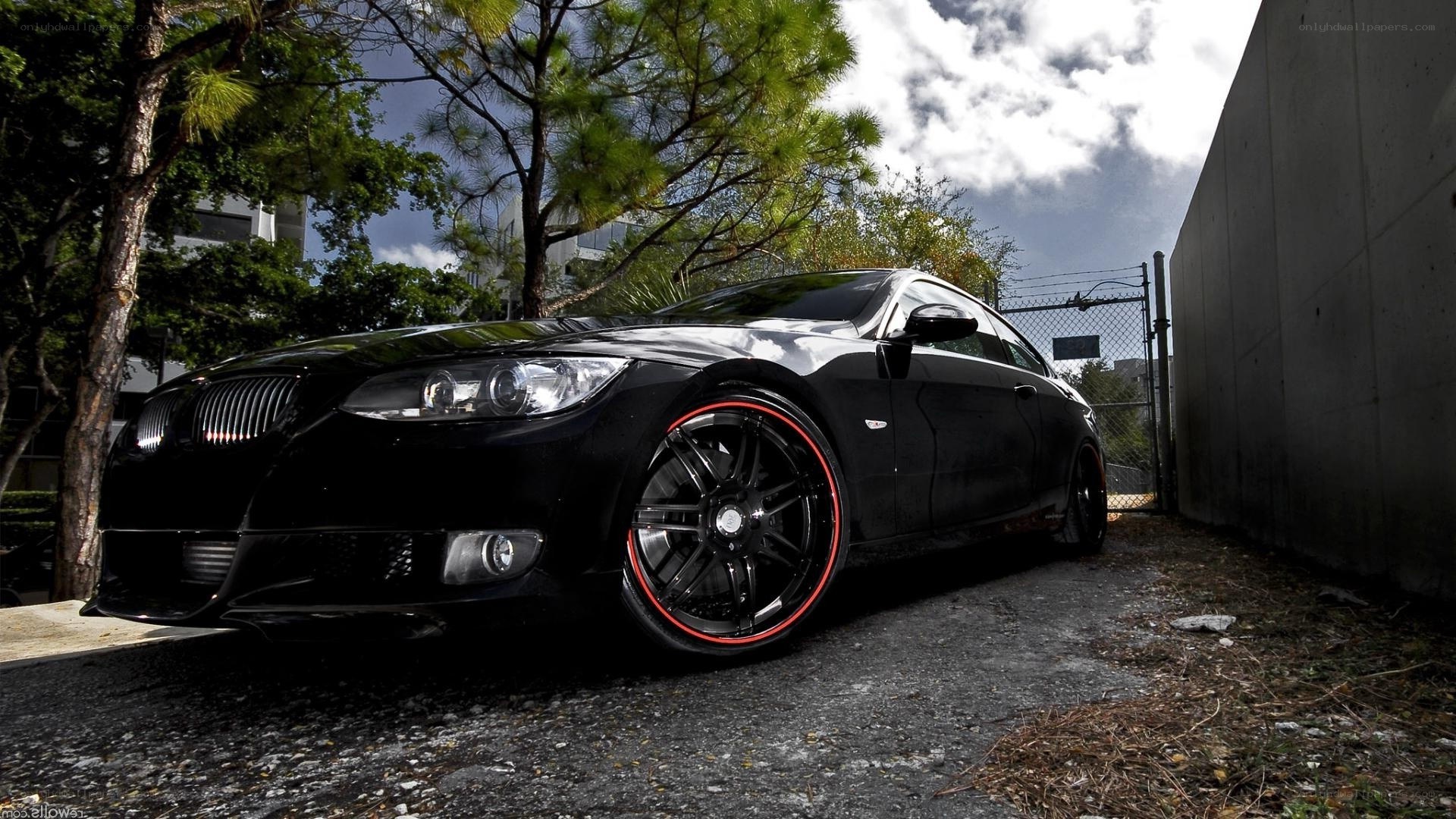 black bmw with red rims