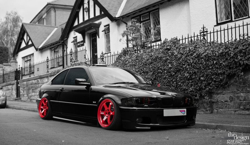black bmw with red wheels