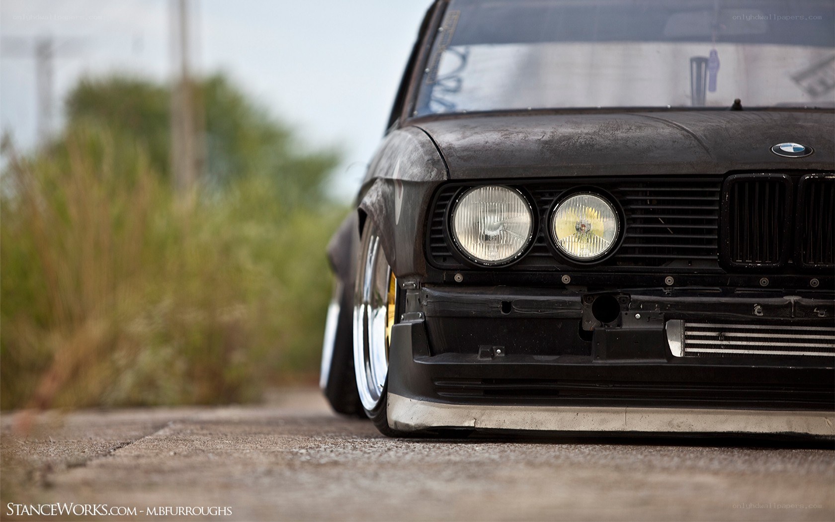 black bmw with wide body