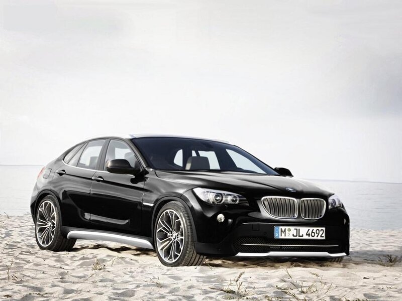 Black BMW X1 on a sandy beach
