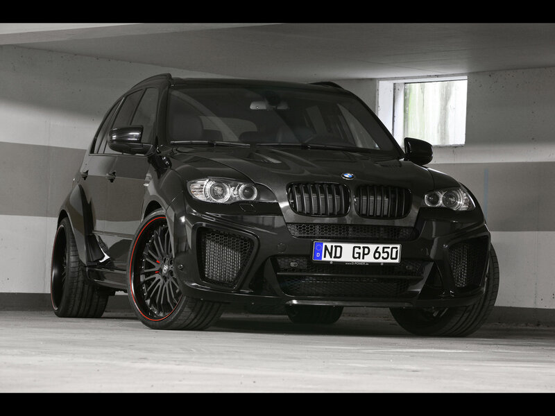Black BMW X5 in parking garage