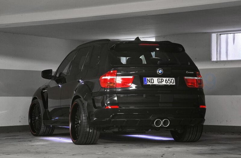 Black BMW X5 in parking garage