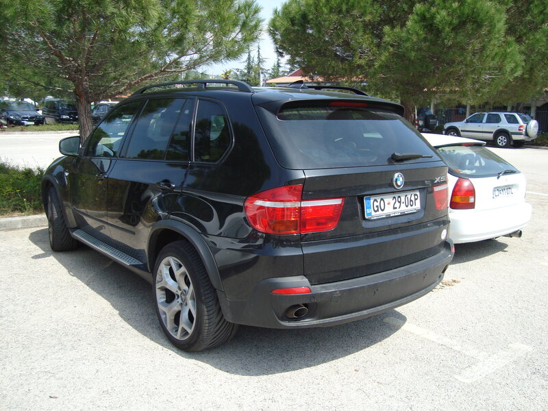 Black BMW X5 in parking lot