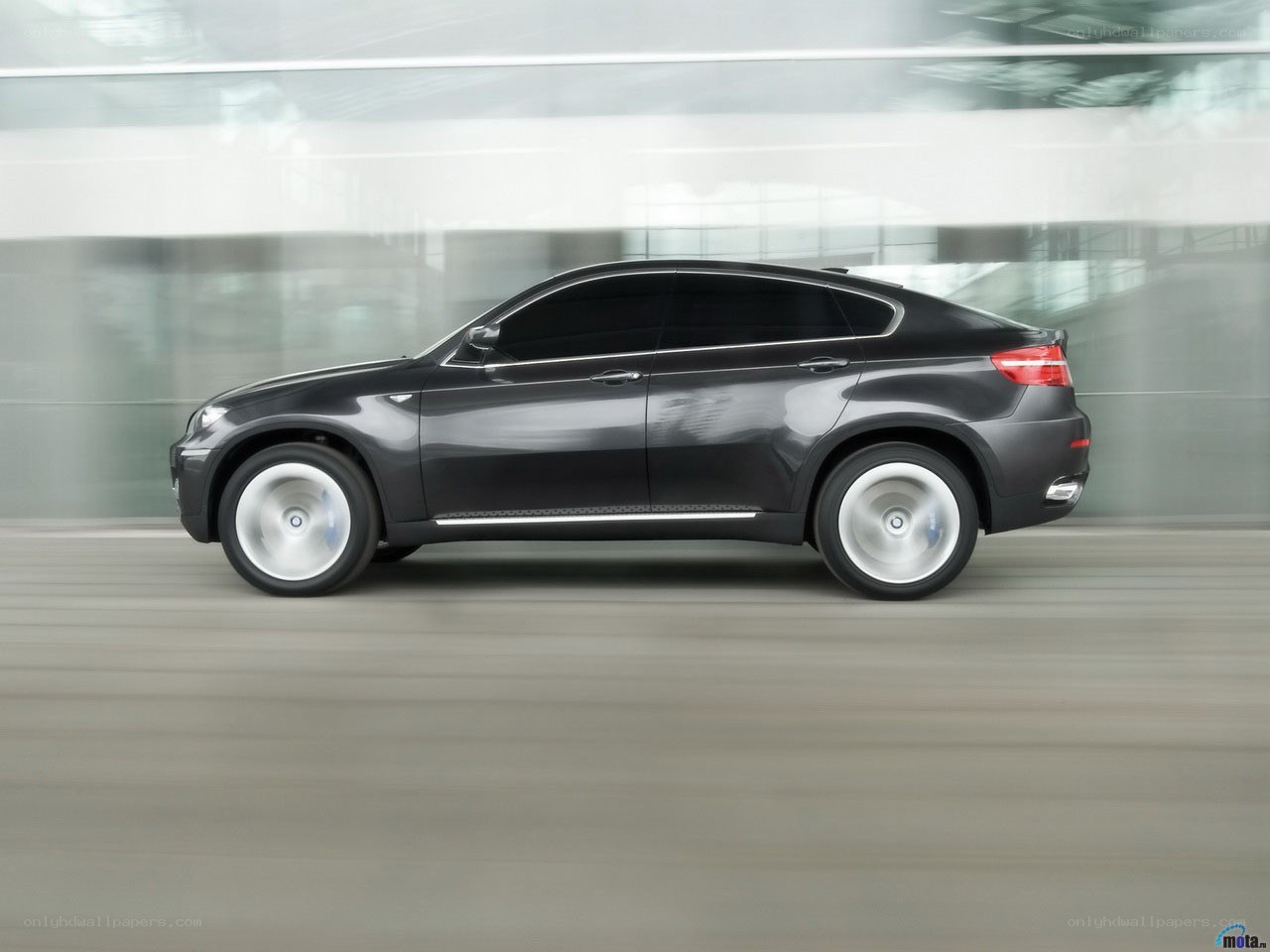 Black BMW X6 in motion