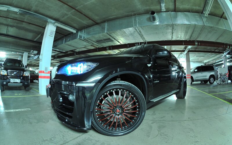 Black BMW X6 in parking garage