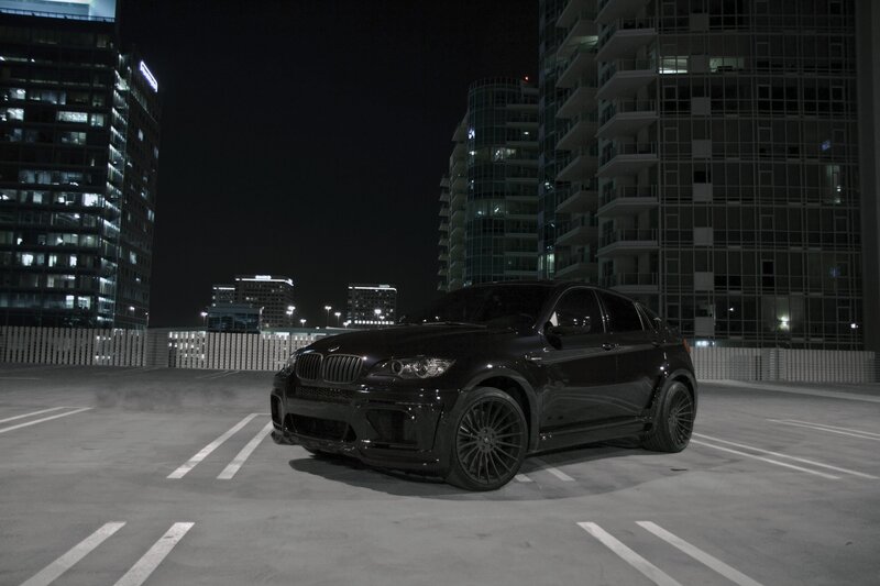 Black BMW X6 in parking garage