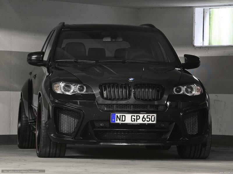 Black BMW X6 in parking garage