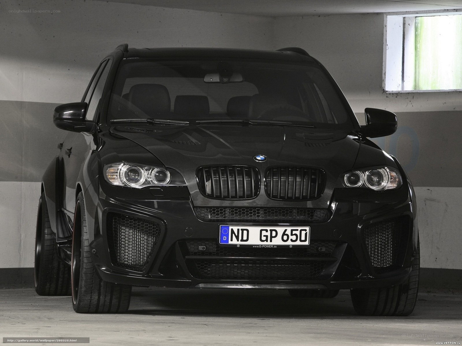 Black BMW X6 in parking garage