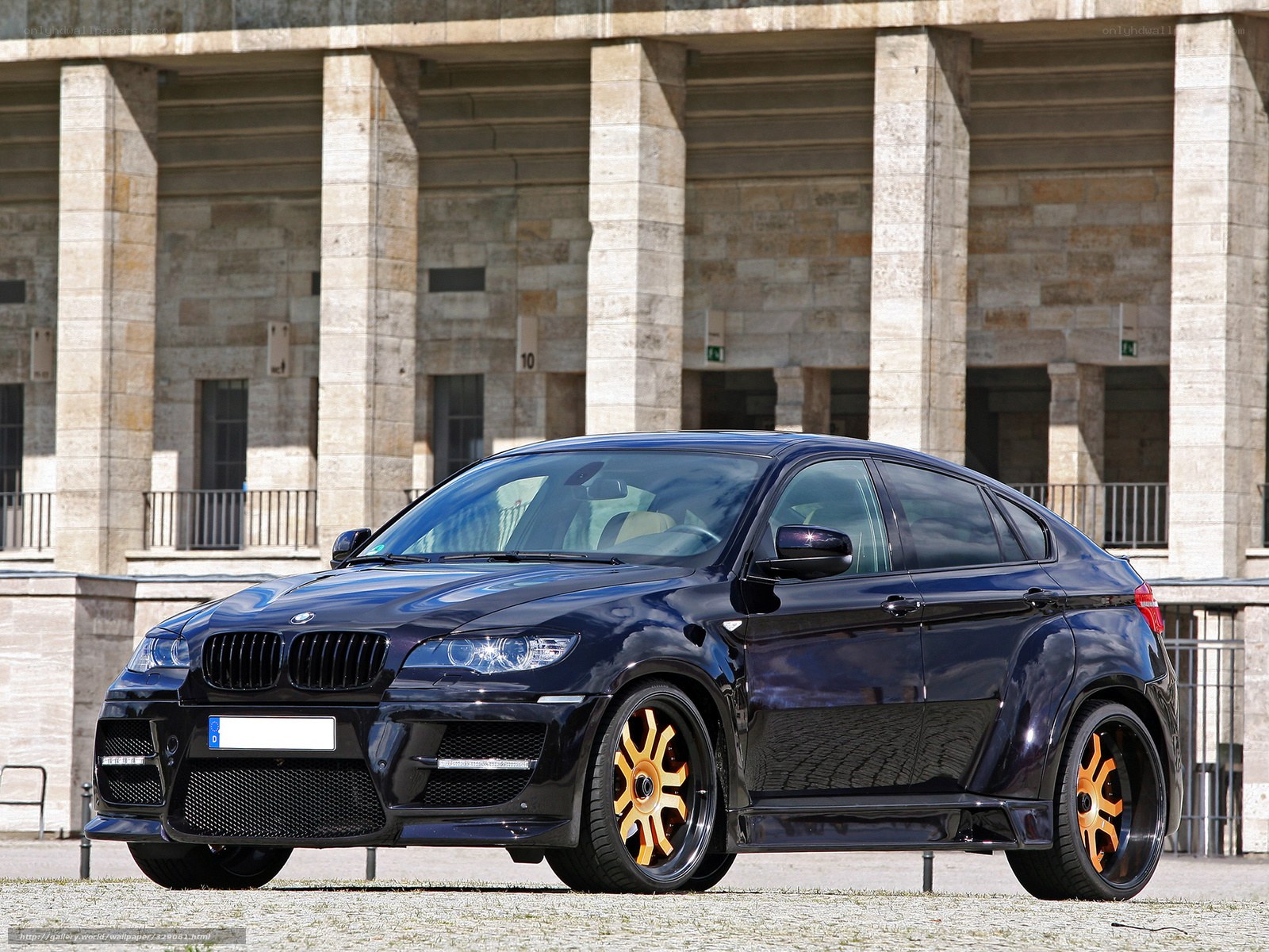 black bmw x6 with gold wheels