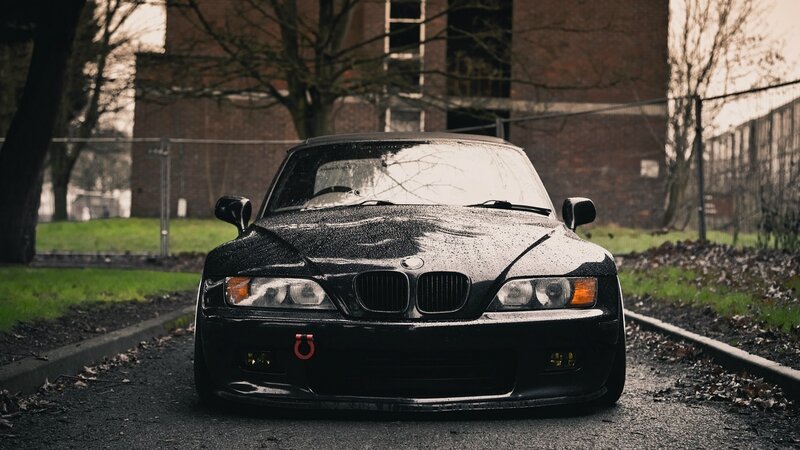 black bmw z3 on wet road