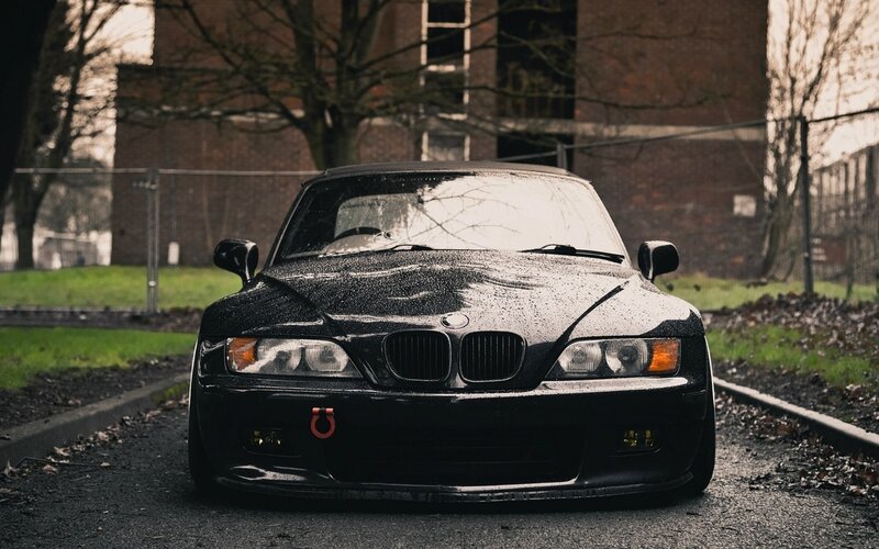 black bmw z3 on wet road