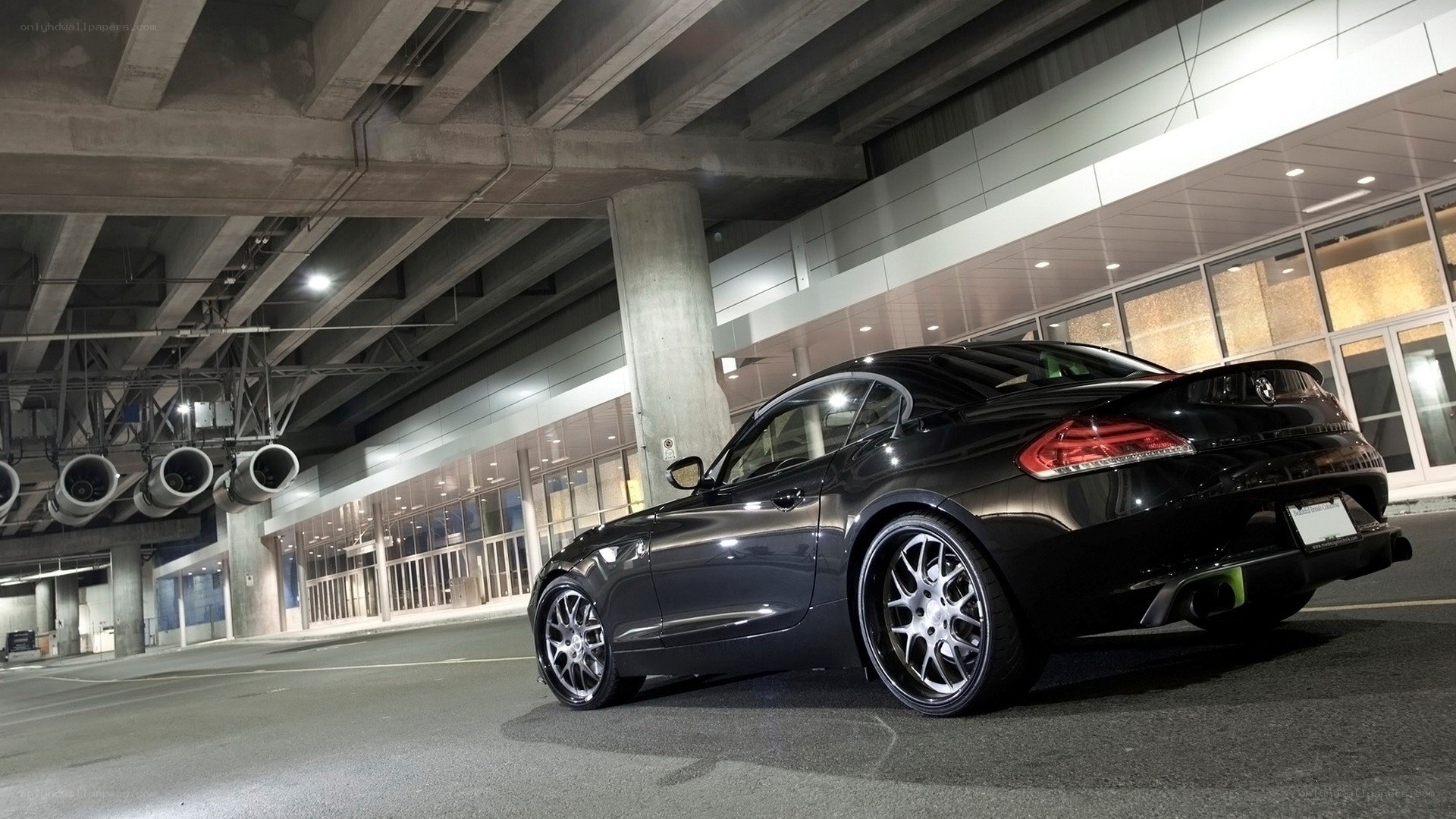 Black BMW Z4 under a bridge
