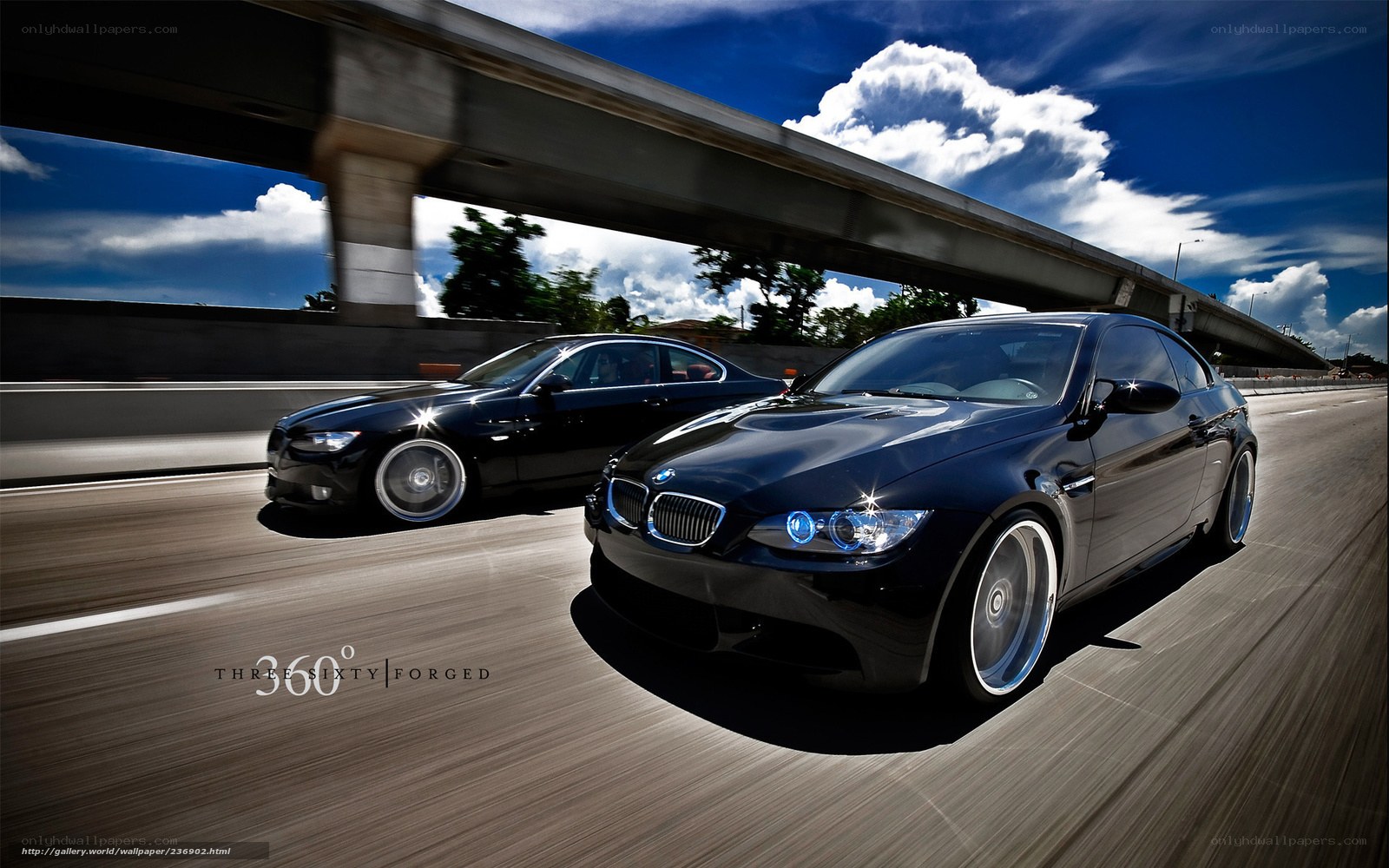 Black BMWs on the highway