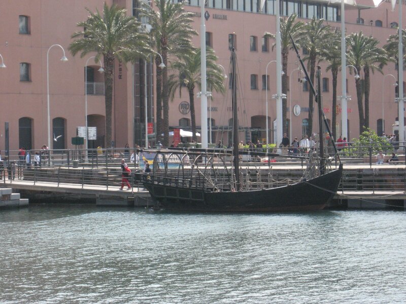 Black boat at waterfront promenade