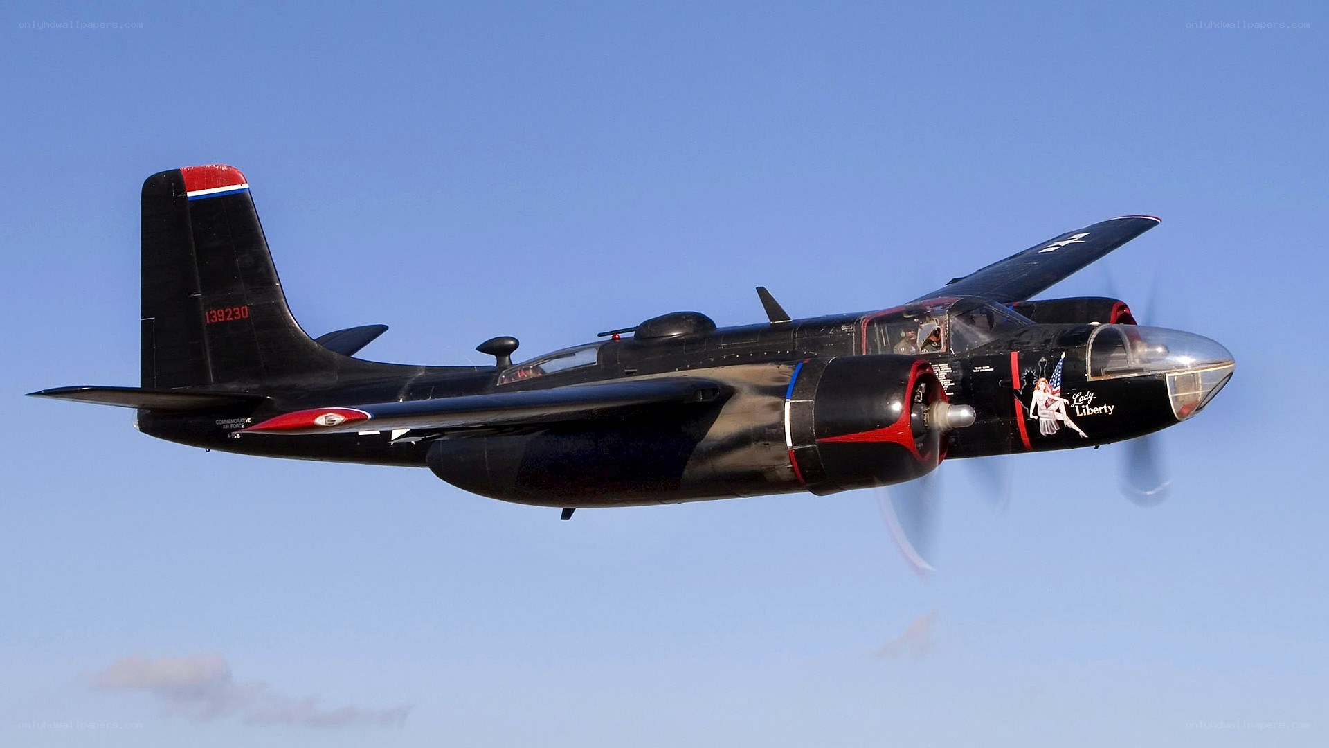 Black bomber aircraft in flight
