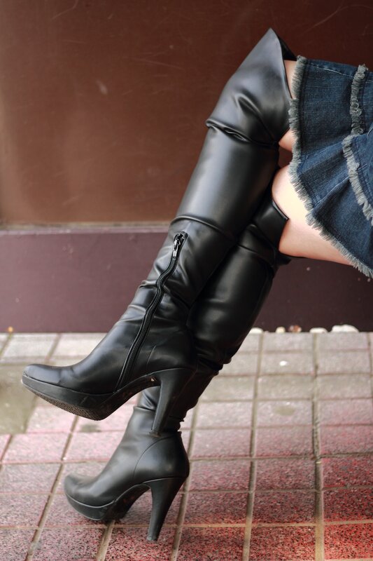 black boots and denim skirt