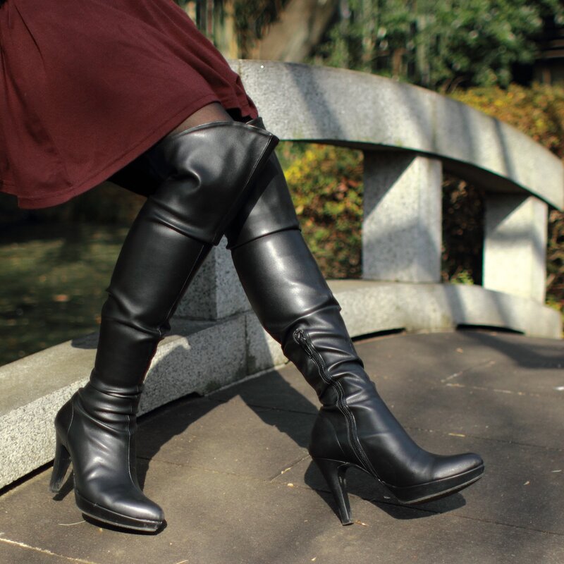 black boots on a bridge