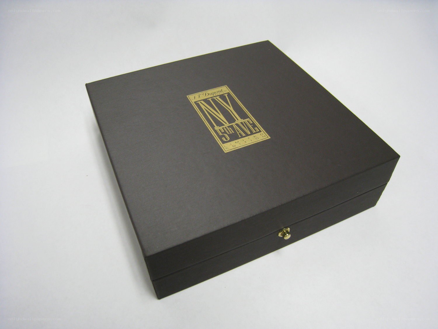 black box with gold logo