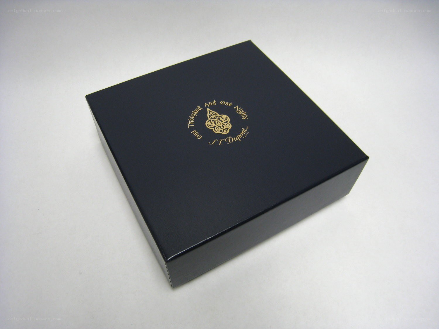 black box with gold logo