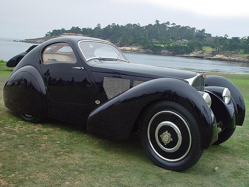 Black Bugatti on a grassy shore