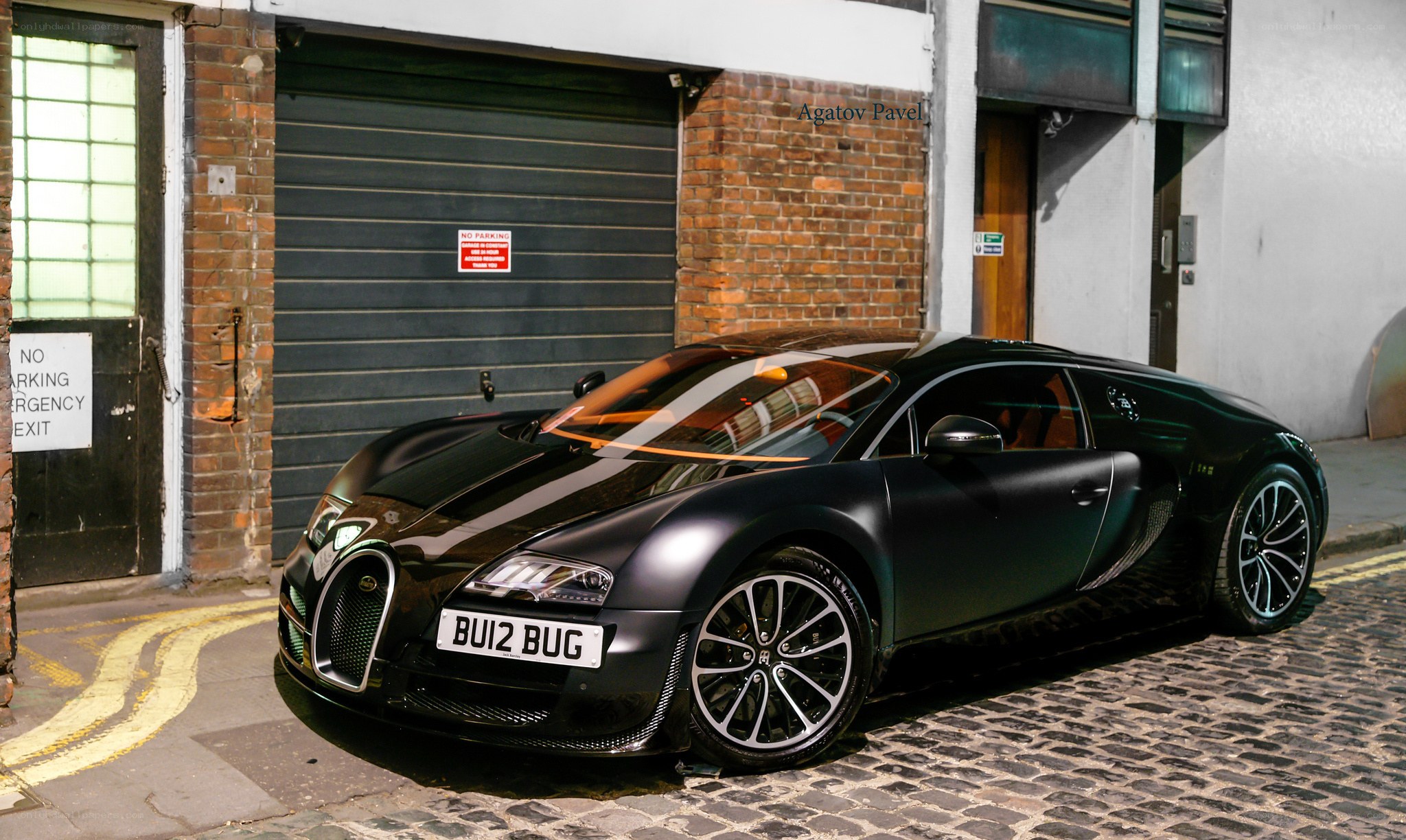 Black Bugatti on cobblestone street