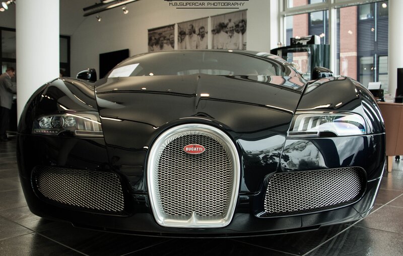 Black Bugatti Veyron — Dramatic, Photograph, Car Showroom, Windows