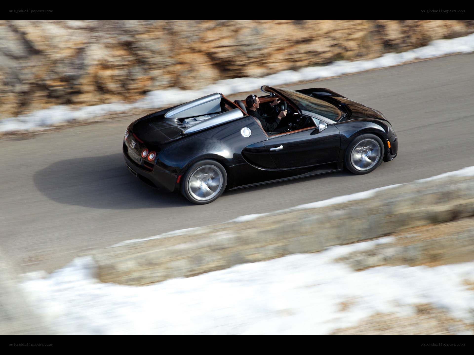 Black Bugatti Veyron driving on road