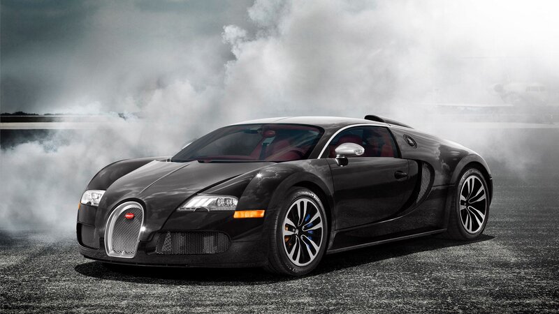 Black Bugatti Veyron on a smoky track