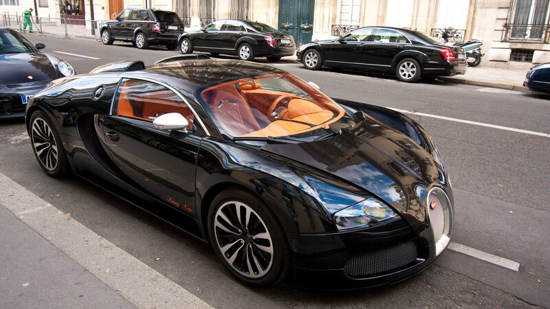 Black Bugatti Veyron on city street