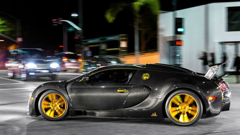 black bugatti with gold wheels