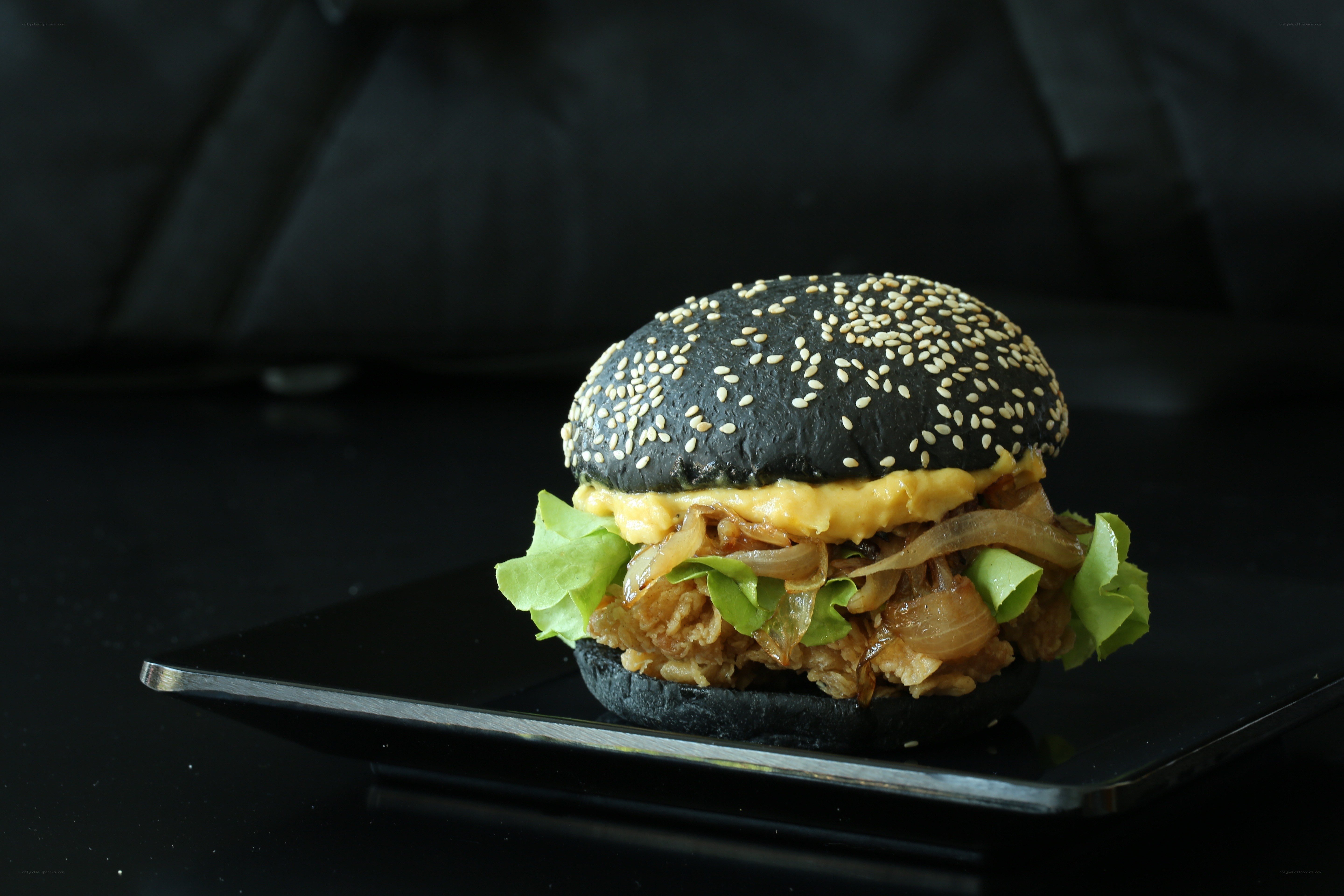 Black burger with sesame seeds