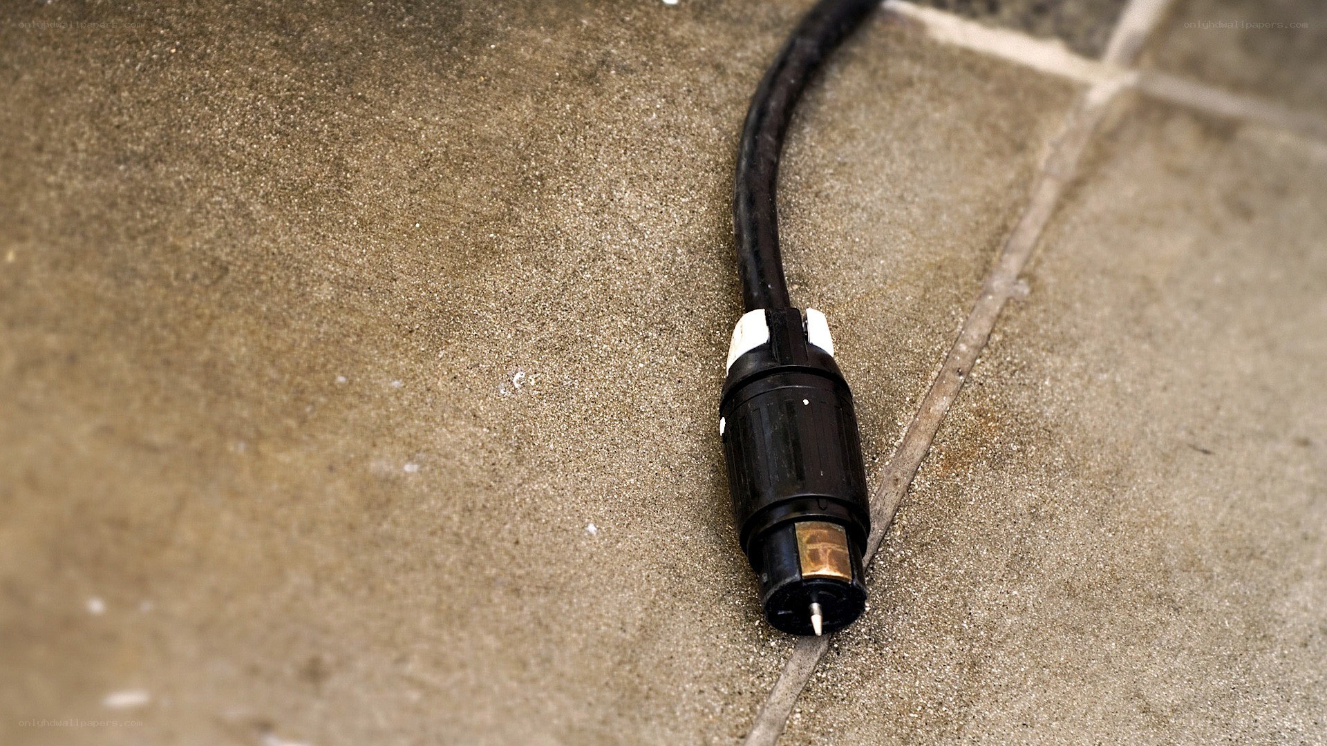 black cable on concrete