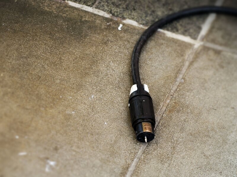 Black Cable on Pavement