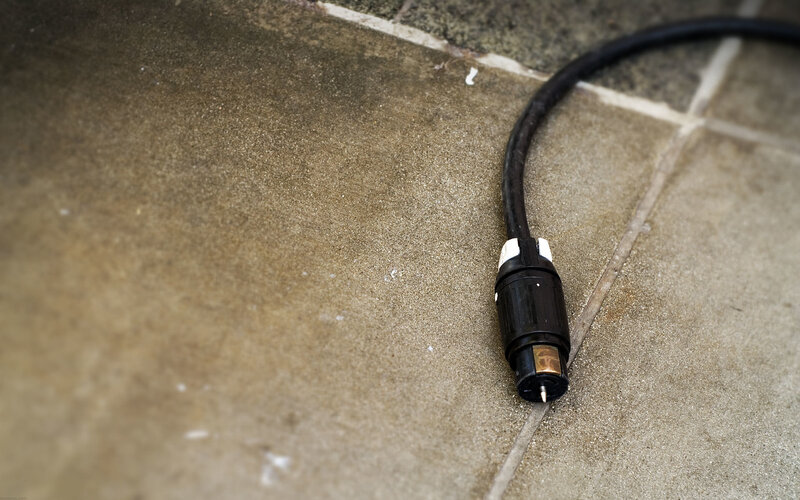 black cable on tiled floor