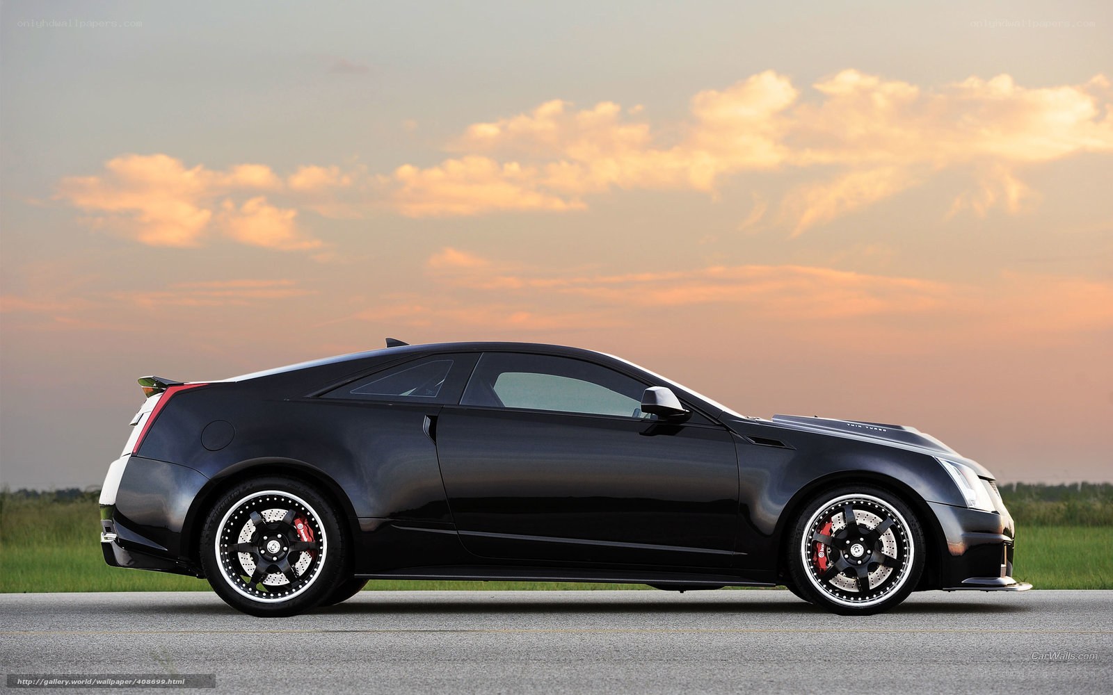black cadillac coupe at sunset