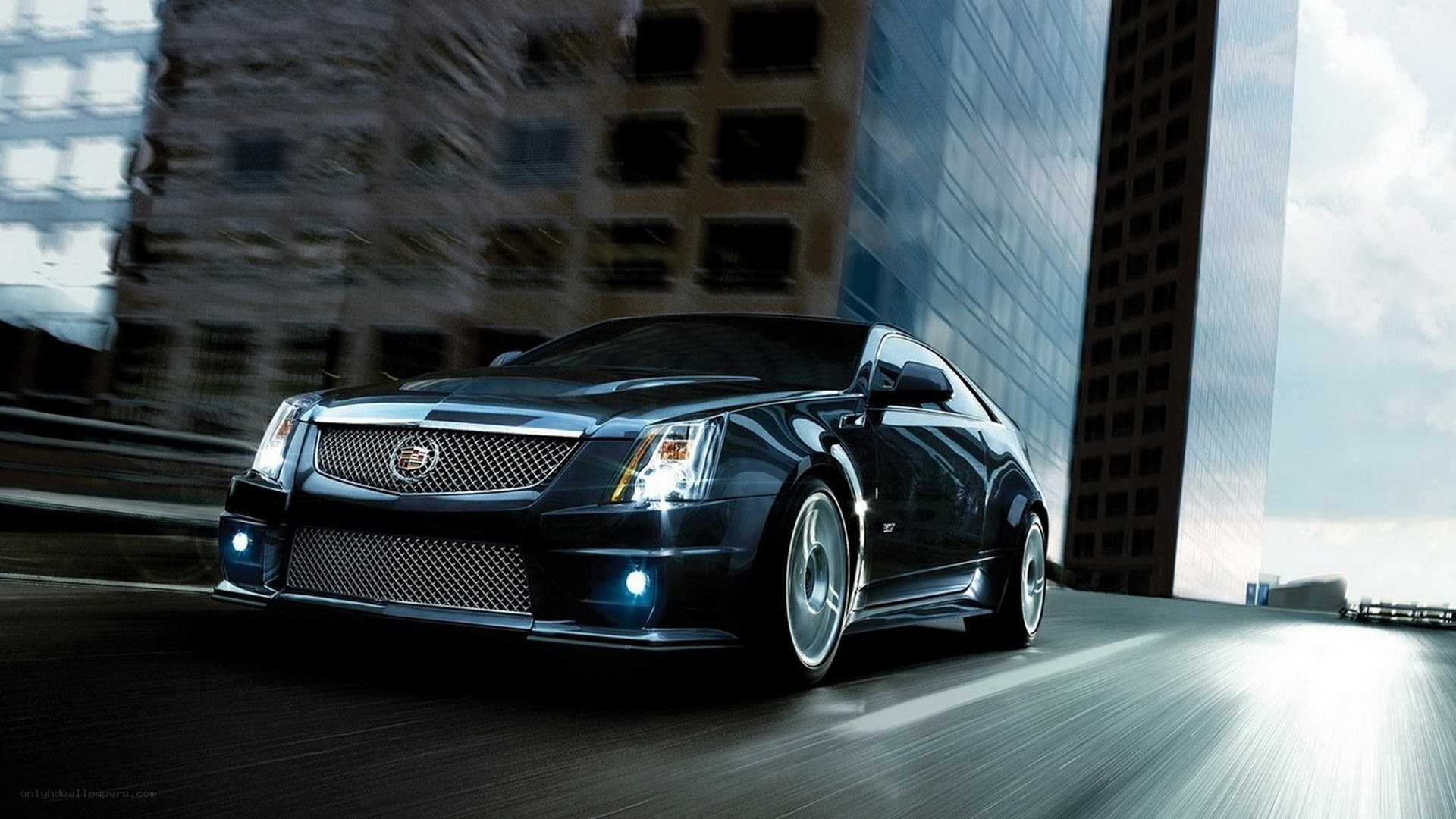 Black Cadillac coupe in city