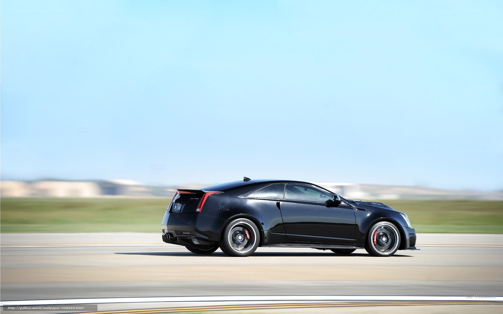 black cadillac coupe on track