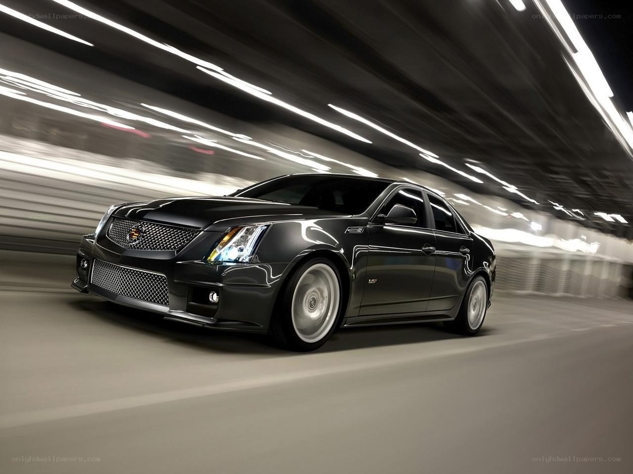 Black Cadillac CTS-V in motion