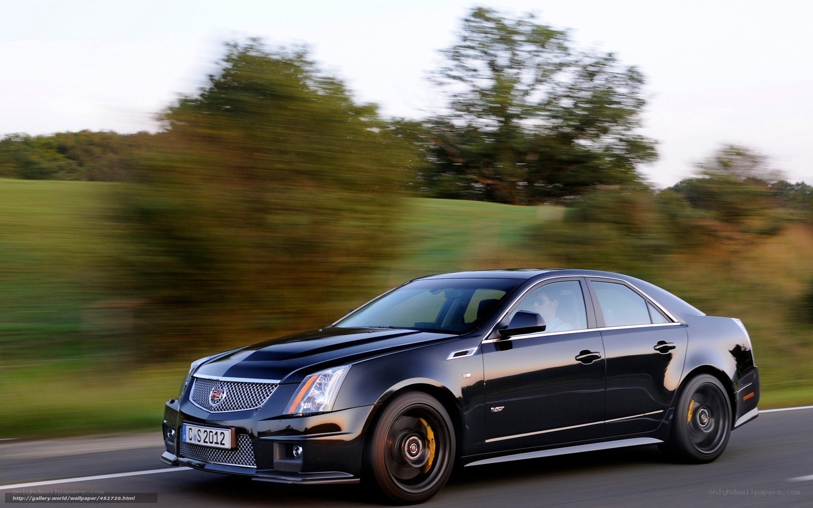 Black Cadillac CTS-V in motion