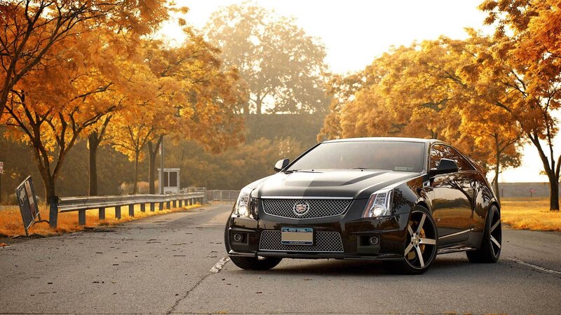Black Cadillac CTS-V on autumn road