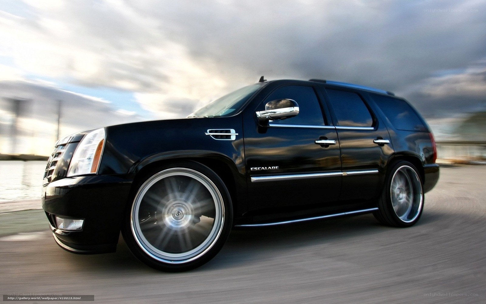 Black Cadillac Escalade in motion