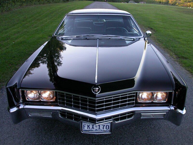 black cadillac on a country road