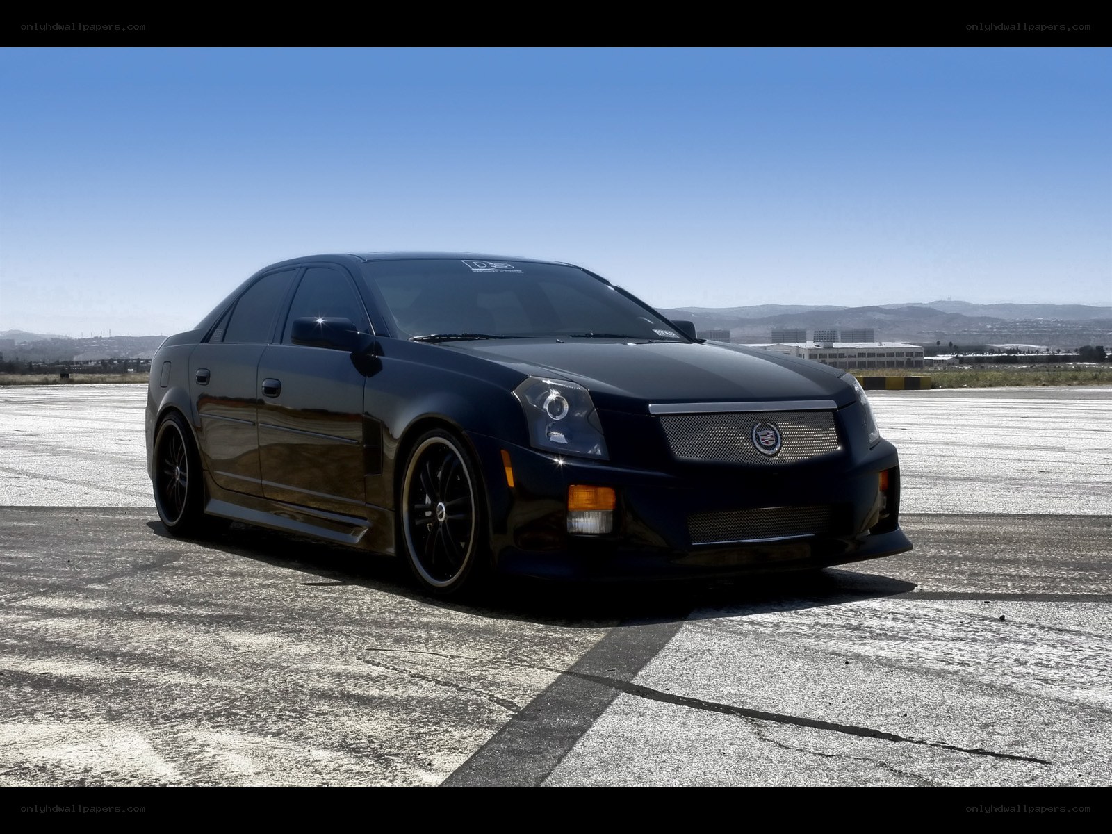black cadillac on tarmac