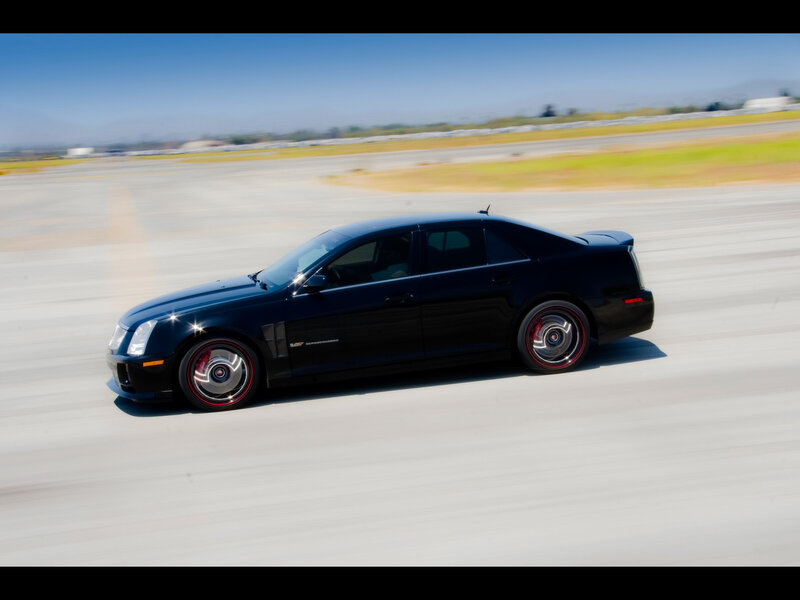 black cadillac on track