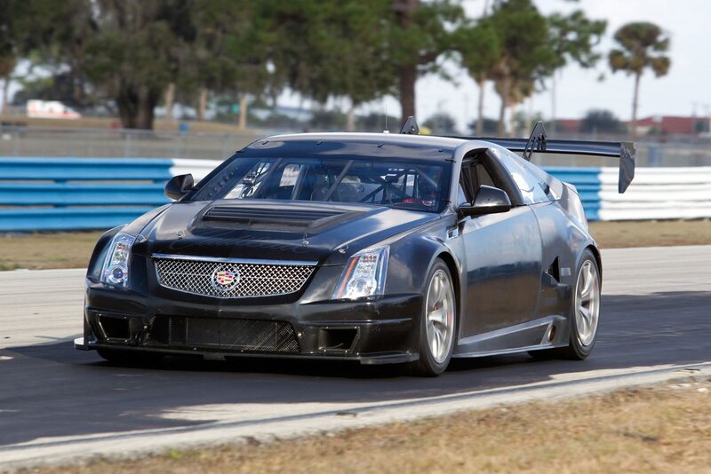 black cadillac race car on track