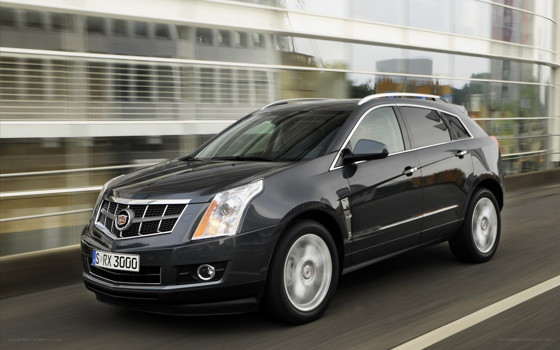 Black Cadillac RX in motion