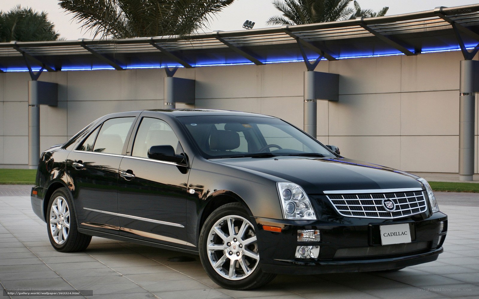 Black Cadillac sedan parked