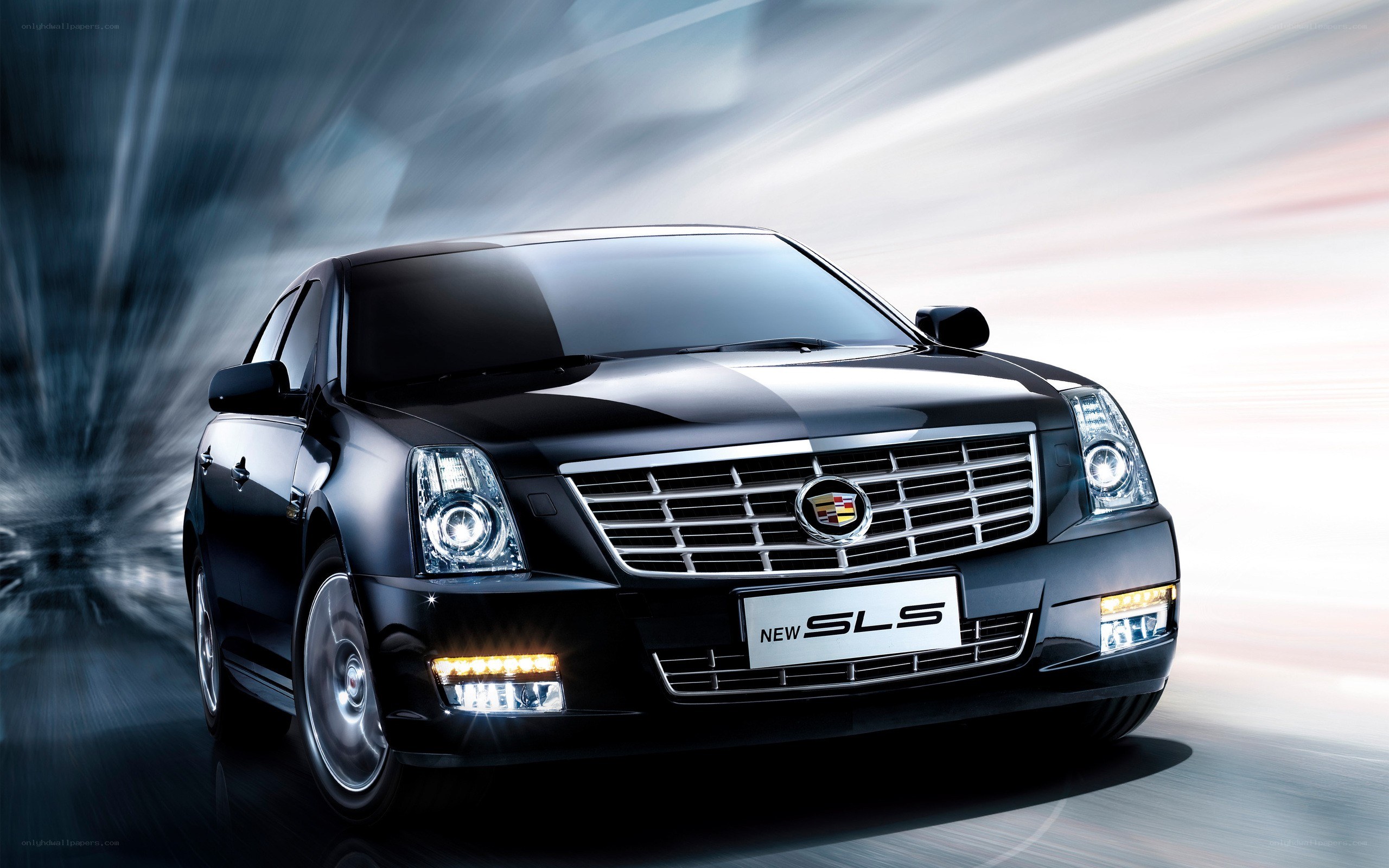 Black Cadillac SLS in motion
