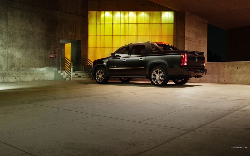 black cadillac truck in garage
